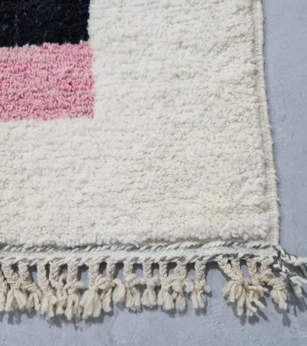 Detailed View of Elara handmade Beni Ourain wool rug with a colorful block design in vibrant pink, mustard yellow, and charcoal gray