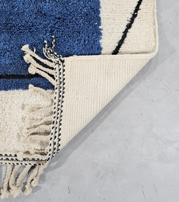 Detailed View of Handmade Moroccan hand-knotted wool rug with plush high-pile texture and bold abstract design from Elara collection