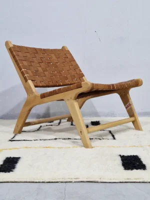 Elly handmade Azilal wool rug with a modern abstract geometric design in black and yellow in room