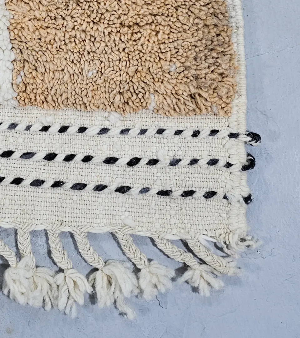 Detailed View of Emy handmade Beni Mrirt wool rug with a contemporary abstract color block design in gray and brown