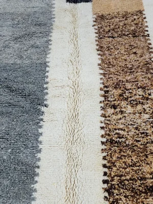 Detailed View of Emy handmade Beni Mrirt wool rug with a contemporary abstract color block design in gray and brown