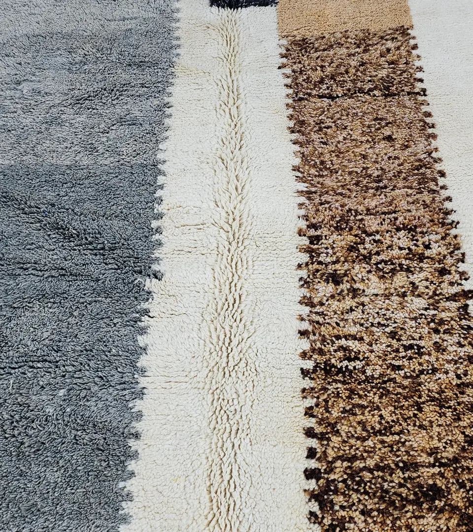 Detailed View of Emy handmade Beni Mrirt wool rug with a contemporary abstract color block design in gray and brown