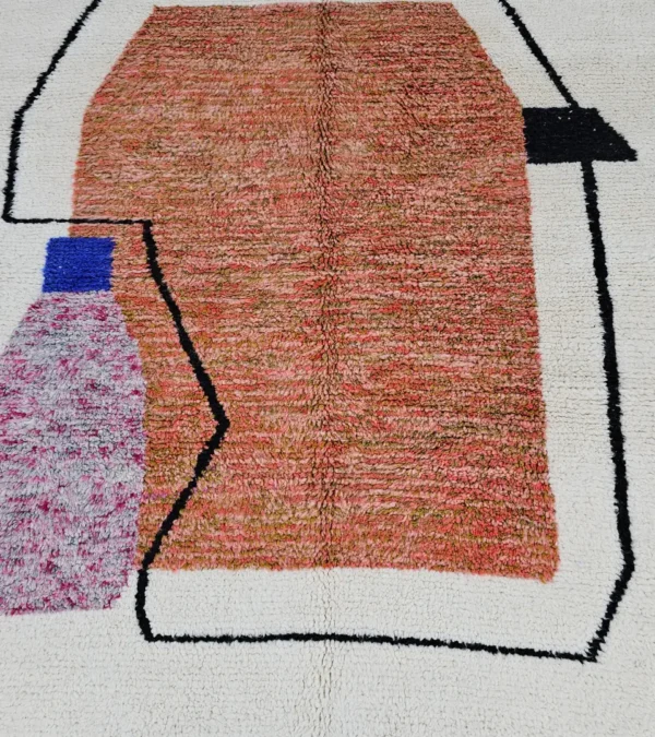 Detailed View of Fairouz handmade Moroccan wool rug with a modern geometric abstract design in terracotta, pink, and black