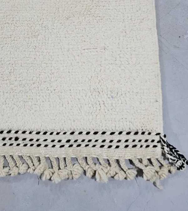 Detailed View of Fairouz handmade Moroccan wool rug with a modern geometric abstract design in terracotta, pink, and black