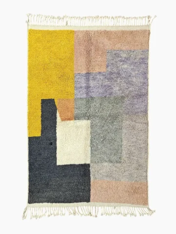 Top View of Farah handmade Beni Ourain wool rug with a Moroccan colorblocked design in yellow, pink, lavender, blue, peach, and ivory