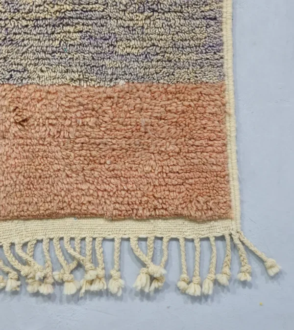 Detailed View of Farah handmade Beni Ourain wool rug with a Moroccan colorblocked design in yellow, pink, lavender, blue, peach, and ivory