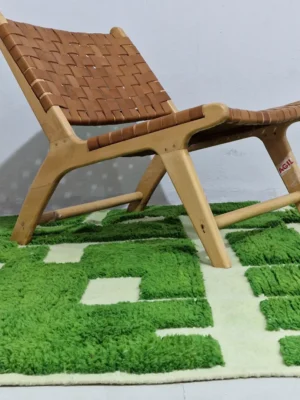Frez handmade wool rug with a minimalist green line pattern and ivory background in room