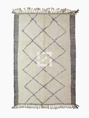 Top View of Ghita handmade Beni Ourain wool rug with a classic dark diamond pattern on an ivory background