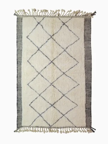 Top View of Ghita handmade Beni Ourain wool rug with a classic dark diamond pattern on an ivory background