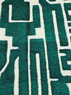Detailed View of Handmade Beni Ourain wool rug with a high/low textured pile and a forest green geometric design