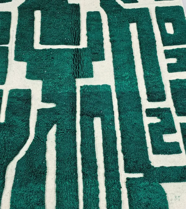 Detailed View of Handmade Beni Ourain wool rug with a high/low textured pile and a forest green geometric design