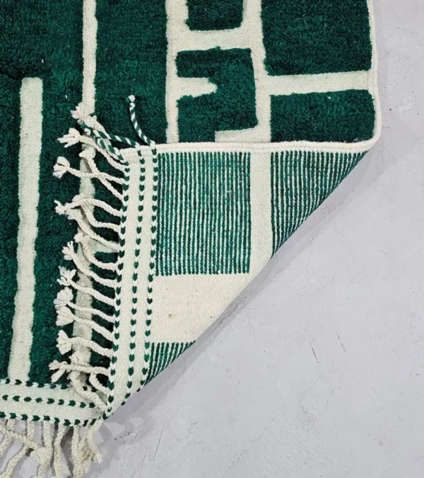 Detailed View of Handmade Beni Ourain wool rug with a high/low textured pile and a forest green geometric design
