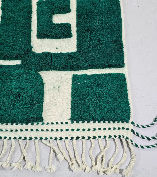 Detailed View of Handmade Beni Ourain wool rug with a high/low textured pile and a forest green geometric design