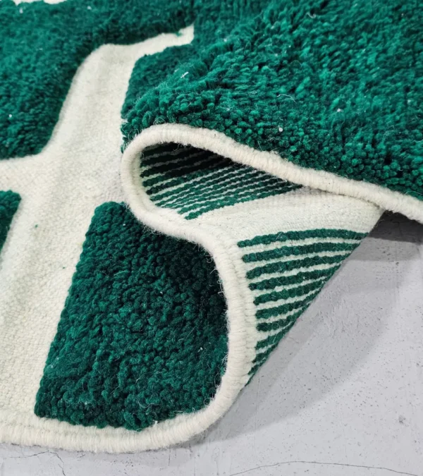 Detailed View of Handmade Beni Ourain wool rug with a high/low textured pile and a forest green geometric design