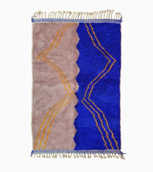 Top View of Handwoven Moroccan rug with a jagged blue and beige design and yellow zigzag lines