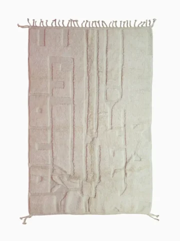 Top View of handmade Moroccan wool rug with a subtle geometric design created by varying pile heights in neutral tones