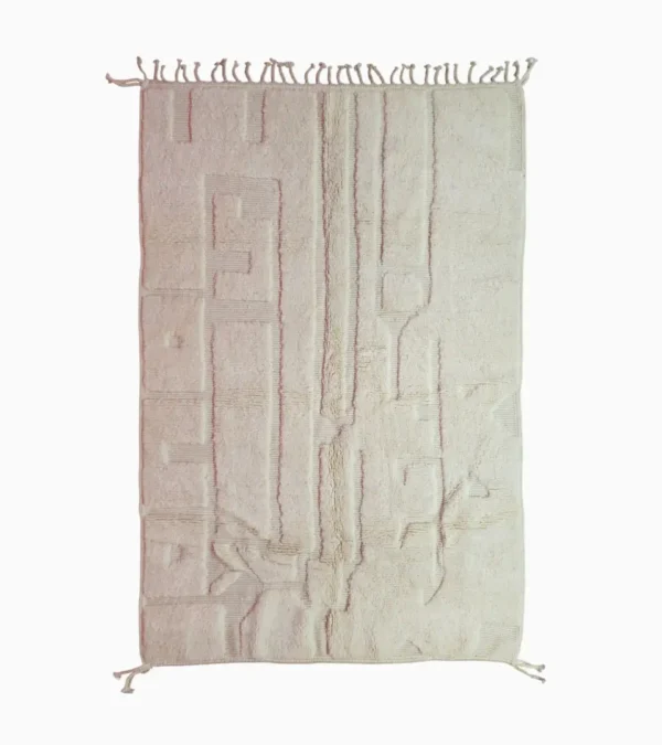 Top View of handmade Moroccan wool rug with a subtle geometric design created by varying pile heights in neutral tones