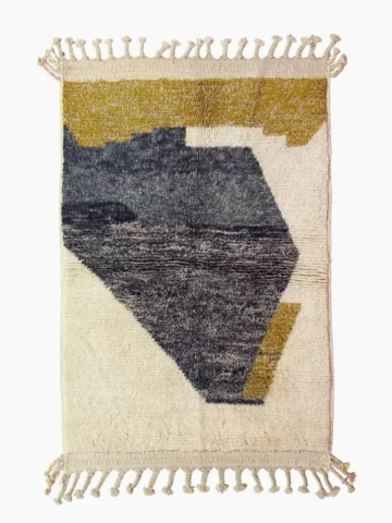 Top View of Imani handmade Beni Ourain wool rug with an abstract geometric design in charcoal gray, mustard yellow, and ivory