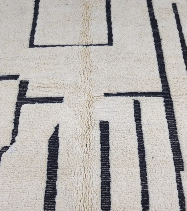 Detailed View of Handmade Moroccan Beni Ourain wool rug with abstract striped pattern in ivory and black