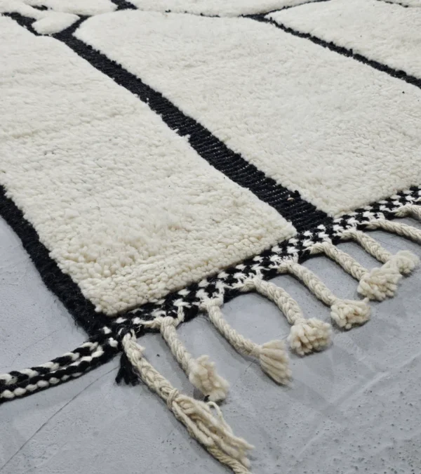 Detailed View of Handmade Moroccan Beni Ourain wool rug with abstract striped pattern in ivory and black