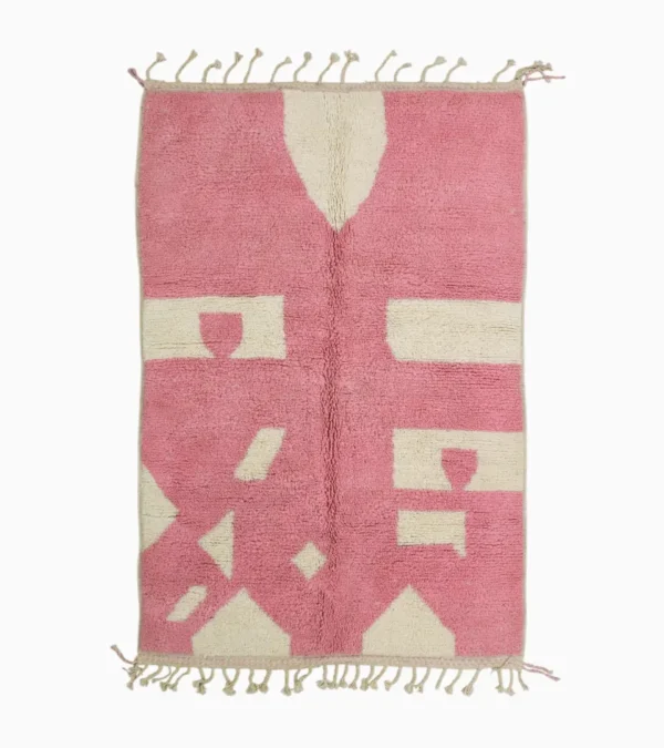 Top View of Juju handmade Moroccan wool rug with a contemporary geometric pattern in pink and ivory