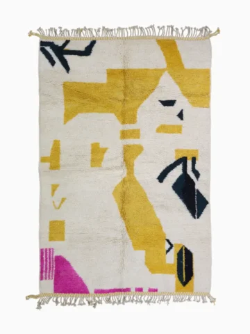 Top View of Kami handmade Beni Ourain wool rug with a contemporary abstract design in yellow, black, and pink
