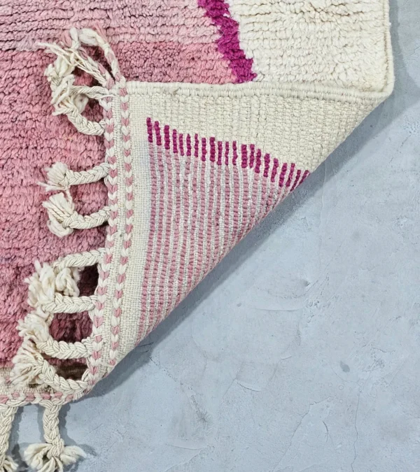 Detailed View of Kami handmade Beni Ourain wool runner with a pink abstract design in fuchsia and ivory