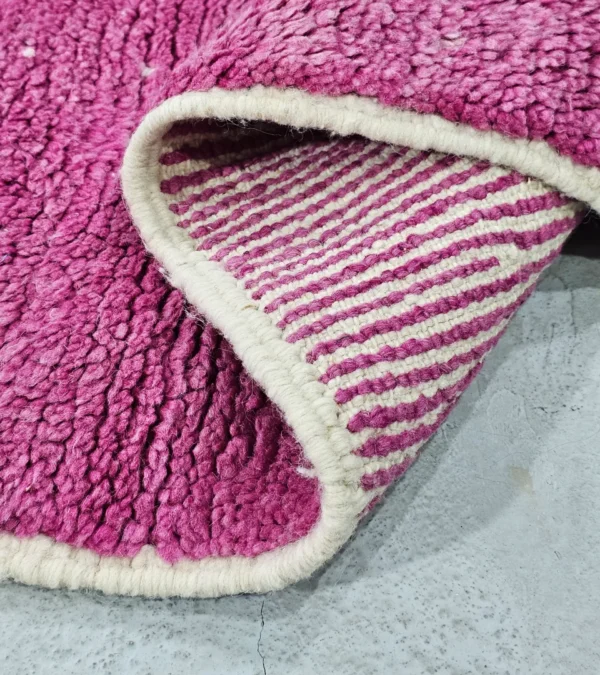 Detailed View of Kami handmade Beni Ourain wool runner with a pink abstract design in fuchsia and ivory