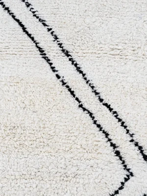 Detailed View of Kareen handmade Beni Ourain wool runner with a minimalist geometric zigzag design in black and ivory