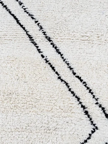 Detailed View of Kareen handmade Beni Ourain wool runner with a minimalist geometric zigzag design in black and ivory