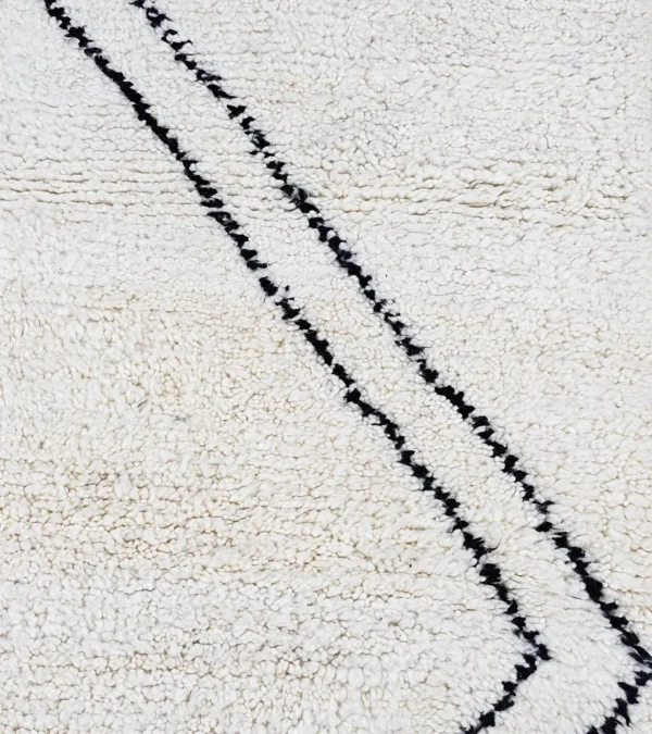 Detailed View of Kareen handmade Beni Ourain wool runner with a minimalist geometric zigzag design in black and ivory