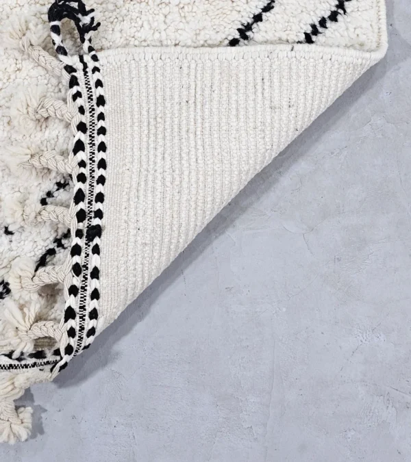 Detailed View of Kareen handmade Beni Ourain wool runner with a minimalist geometric zigzag design in black and ivory