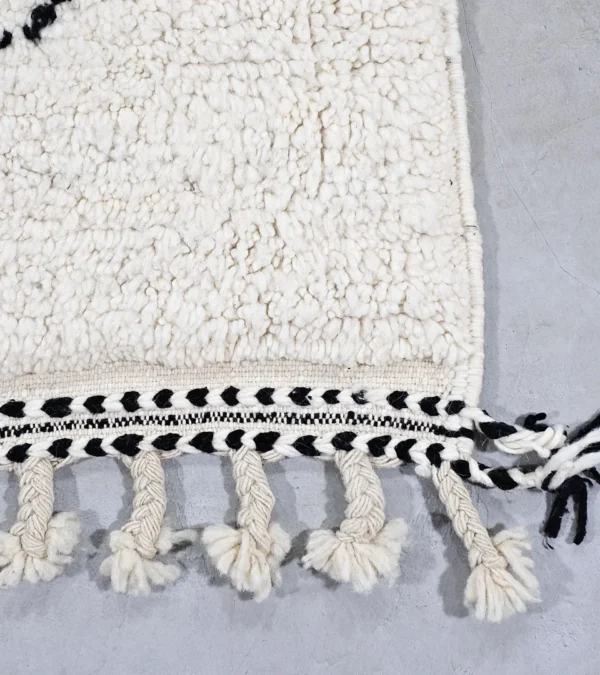 Detailed View of Kareen handmade Beni Ourain wool runner with a minimalist geometric zigzag design in black and ivory