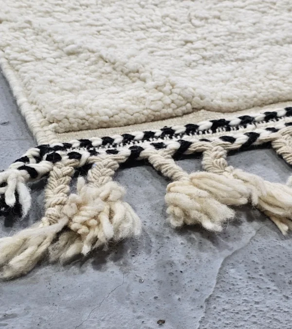 Detailed View of Kareen handmade Beni Ourain wool runner with a minimalist geometric zigzag design in black and ivory