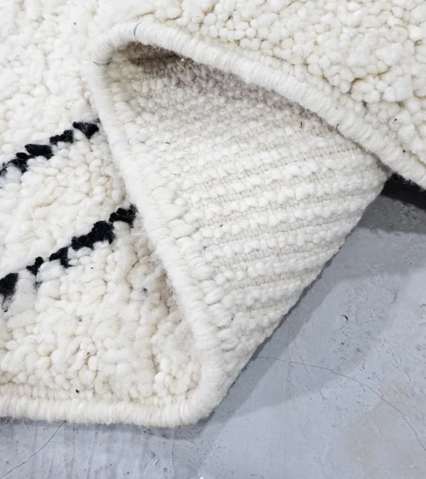 Detailed View of Kareen handmade Beni Ourain wool runner with a minimalist geometric zigzag design in black and ivory
