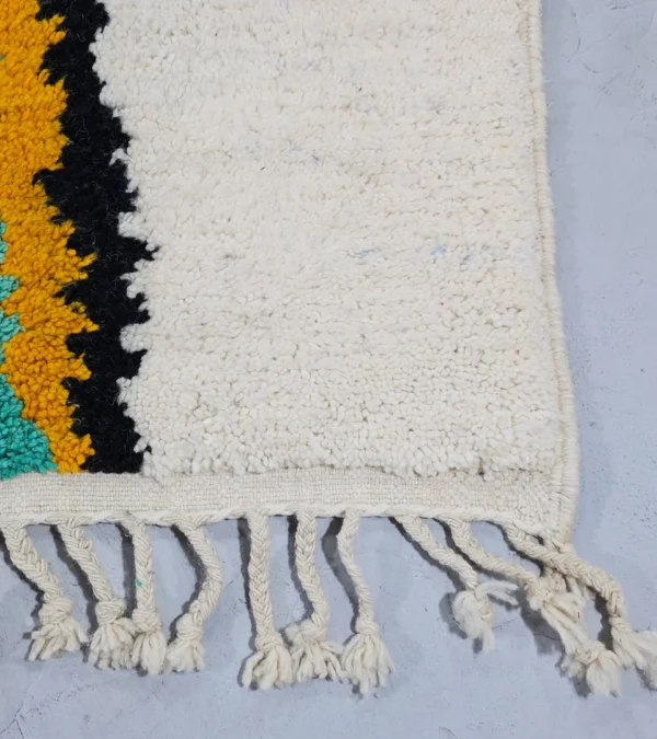 Detailed View of Moroccan Azilal wool rug with symbolic color-rich design from the Kezrah Tapestry Flow series