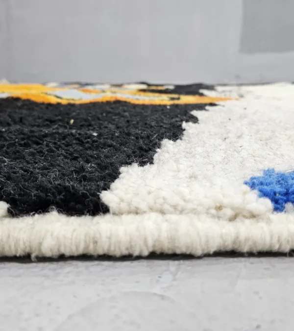 Zoomed In View of Moroccan Azilal wool rug with symbolic color-rich design from the Kezrah Tapestry Flow series