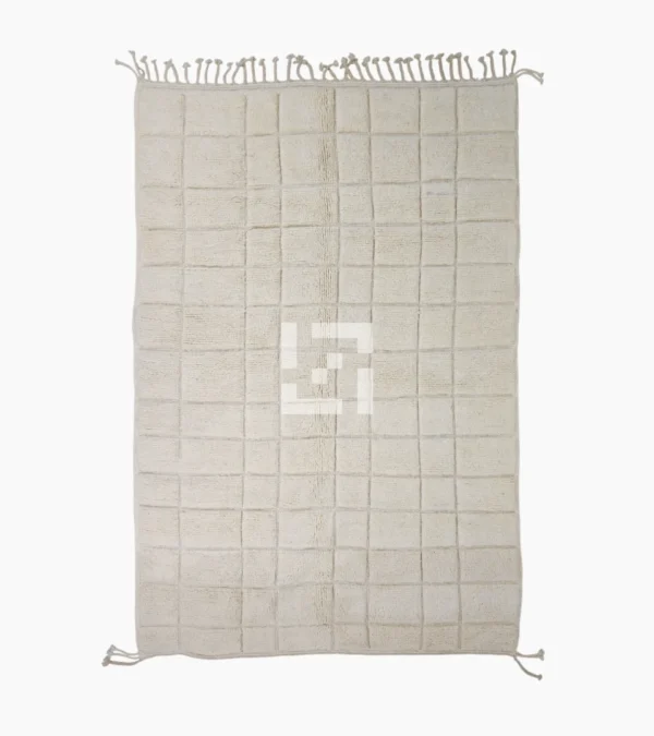 Top View of Lara handmade Beni Mrirt wool rug with a minimalist grid pattern in ivory created with a high/low pile
