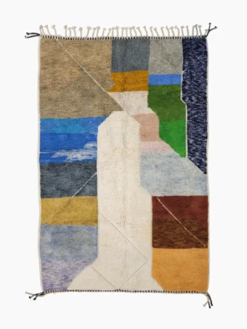 Top View of Leila handmade Beni Mrirt wool rug with a contemporary abstract patchwork design in multicolor, including brown, blue, yellow, and gray
