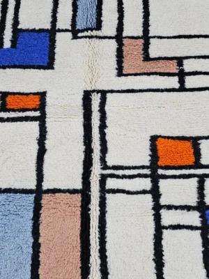 Detailed View of Lina handmade Beni Ourain wool rug with a modern abstract geometric design in blue, brown, and orange