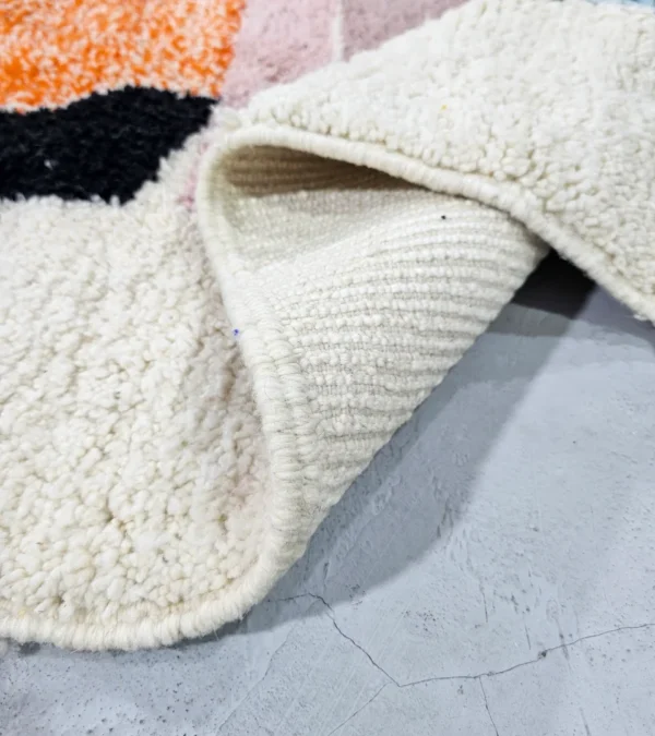 Detailed View of Handmade Moroccan wool rug with abstract multicolor geometric shapes