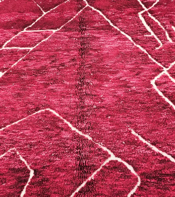 Detailed View of Lina handmade Beni Mrirt wool rug with an abstract lined design in red and ivory
