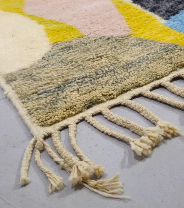 Detailed View of Liora handmade Beni Ourain wool rug with a vibrant abstract design in green, blue, yellow, and pink