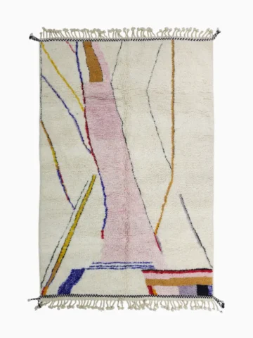 Top View of Handmade Moroccan Azilal wool rug with unique abstract pink, yellow, blue, and brown lines and shapes on an ivory background