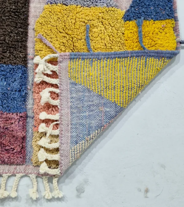 Detailed View of Handmade Moroccan wool rug with a modern abstract design and a high-low pile