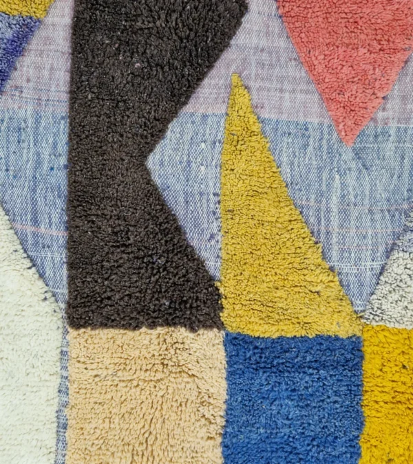 Detailed View of Handmade Moroccan wool rug with a modern abstract design and a high-low pile