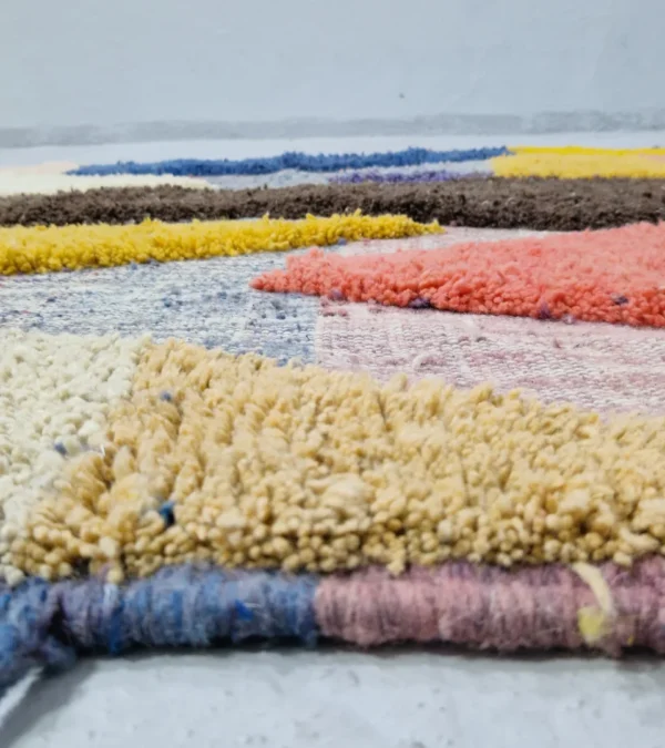 Zoomed In View of Handmade Moroccan wool rug with a modern abstract design and a high-low pile