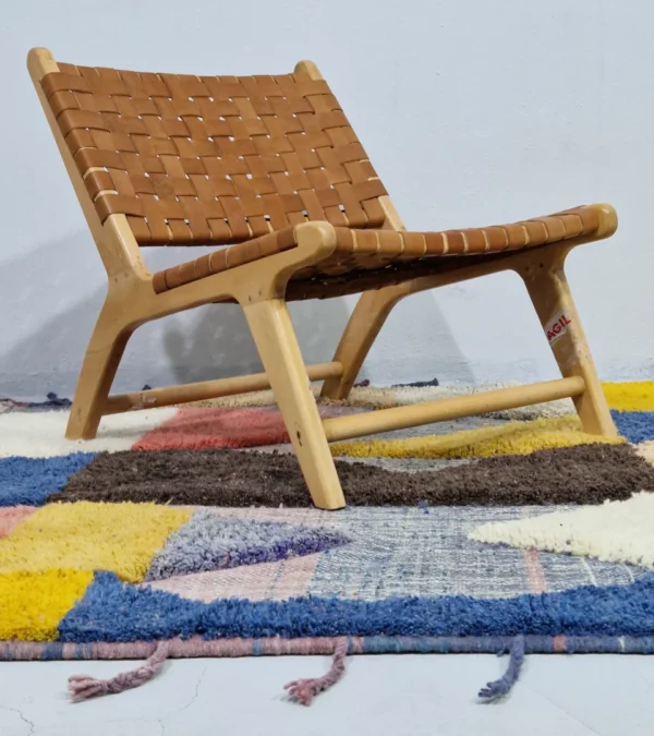 Colorful Handmade Moroccan wool rug with a modern abstract design and a high-low pile in room