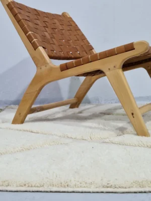 Handmade Moroccan wool rug with a raised diamond trellis pattern in off-white in room