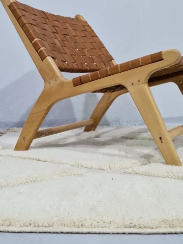 Handmade Moroccan wool rug with a raised diamond trellis pattern in off-white in room